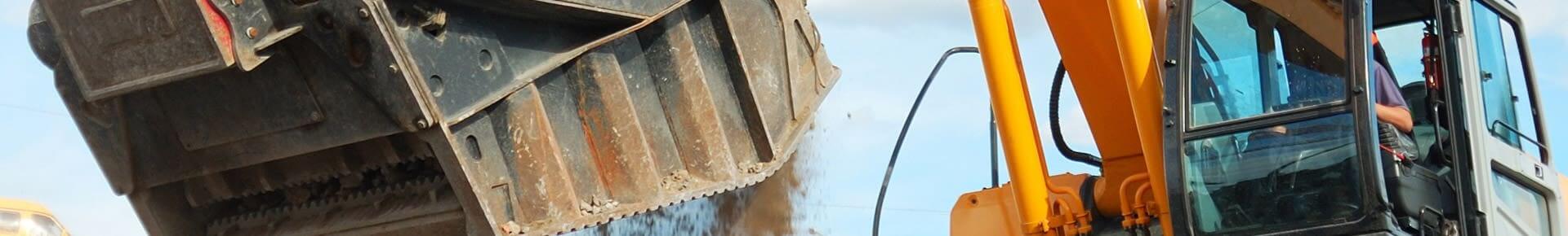 Yellow Excavator Dumping Dirt