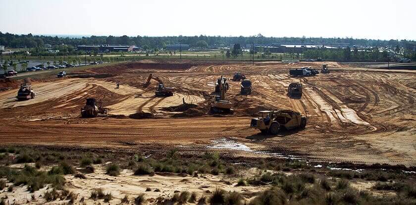 Earthwork moving equipment on a construction job site