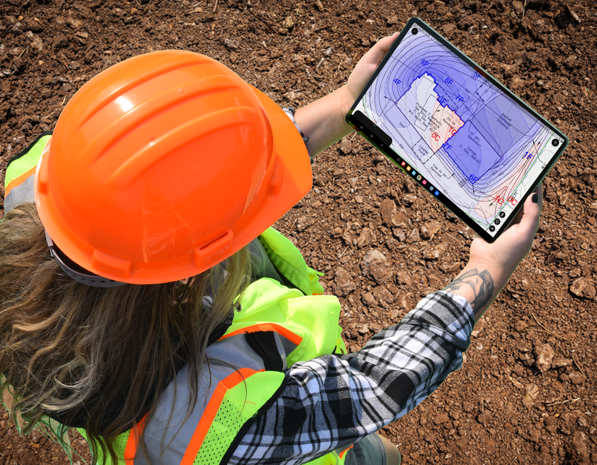 Woman construction worker holding a tablet with Elevation Pro on the screen